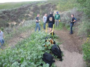 Young sailors working on an upslope switchback drainage