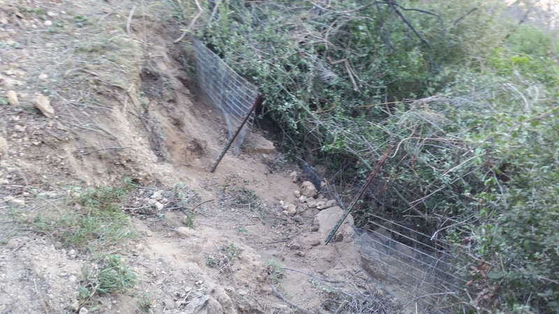 Failed wire basket retaining wall