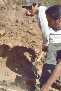 Fixing the tight, rocky switchback at the bottom of the Wood Canyon Vista Trail, part of the Backbone Trail.