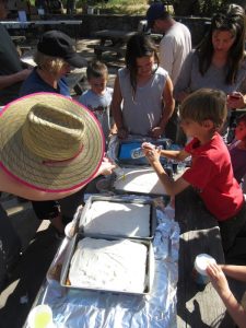 Decorating the dessert cakes for Saturday's dinner